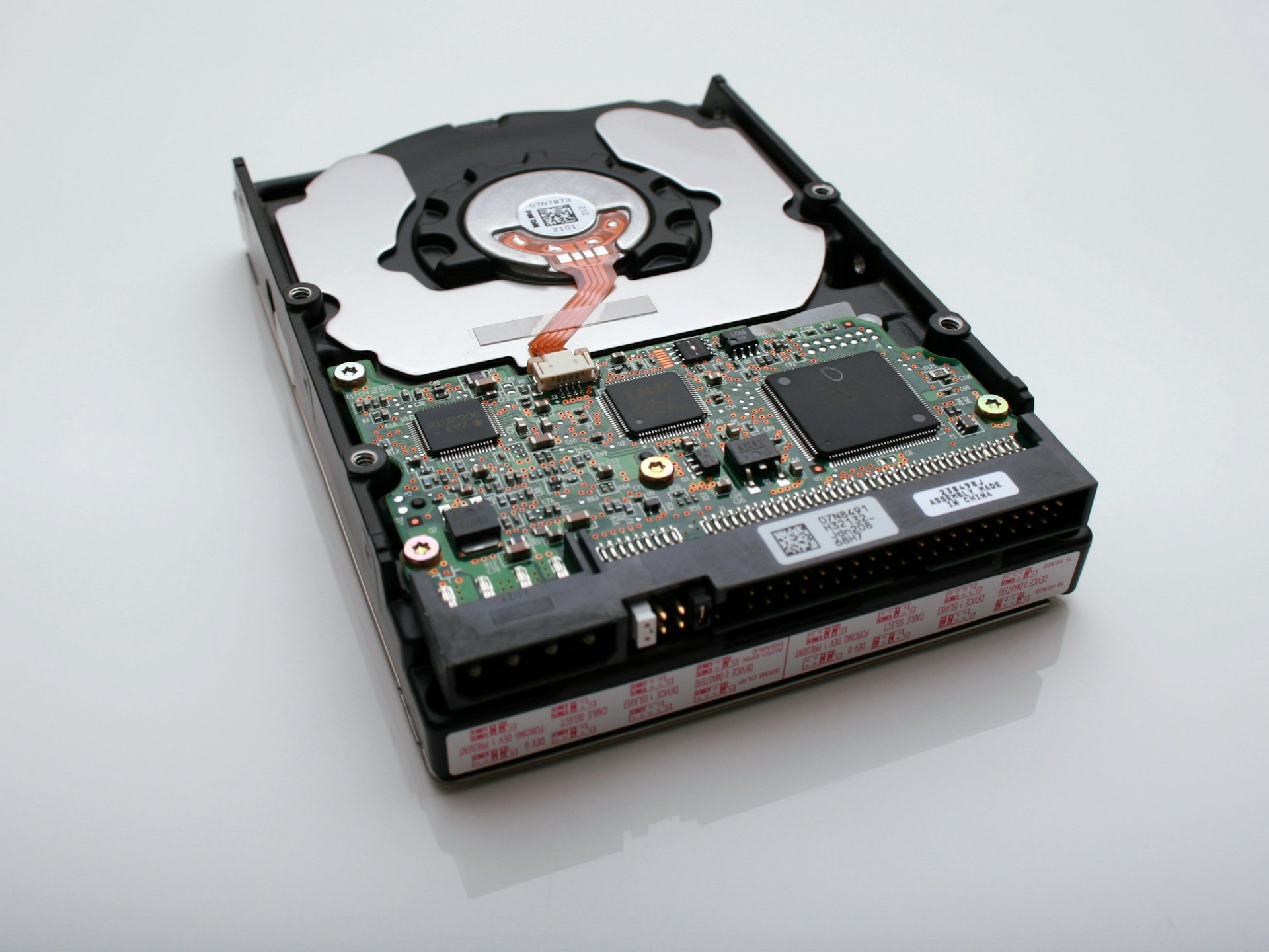 Close-up of an open hard drive showcasing internal components, representing expert data recovery services in Riga, Latvia. Recovery available for HDDs, SSDs, USB drives, memory cards, and more.